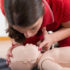 First Aid Training - Cardiopulmonary resuscitation. First aid course on baby dummy
